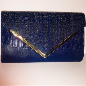 Clutch with gold and sparkle accents.